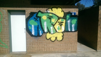 Dustless blasting of graffiti removal before image