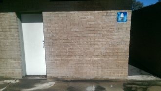Dustless blasting of graffiti removal after image