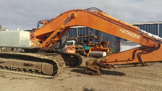 Dustless blasting of large excavator before image